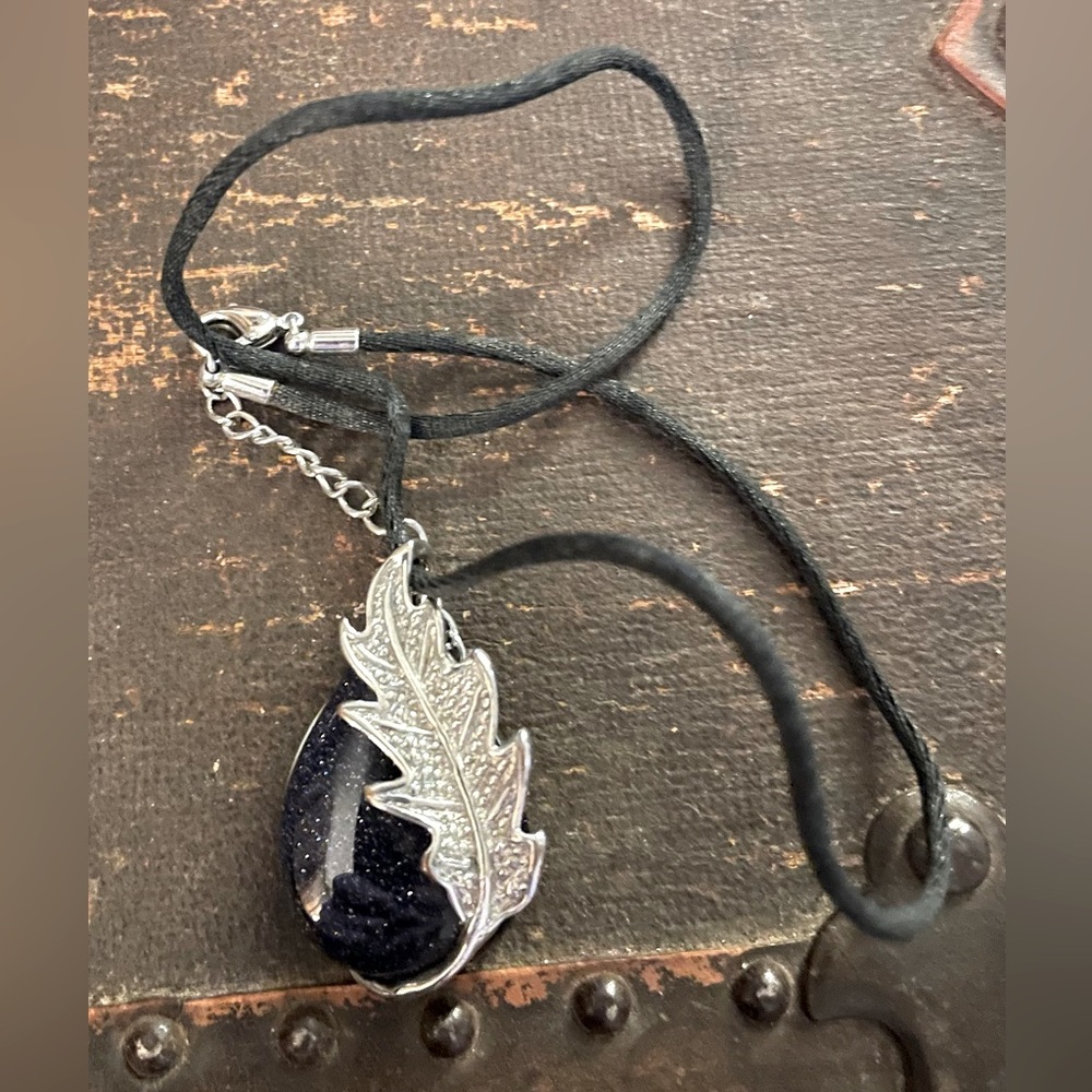 Teardrop Shaped Black Glittery Pendant with Silver Leaf and Black Silky Cord